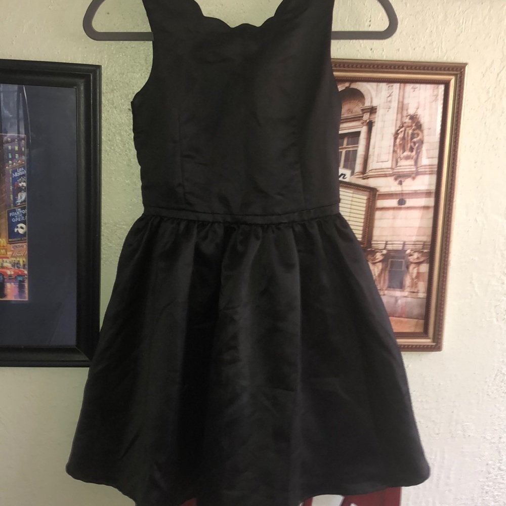 black dress with gold zipper on the back